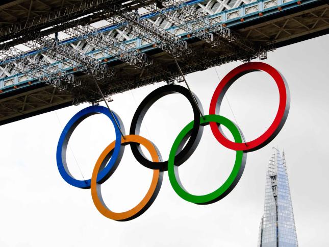 The Olympic rings hanging from a bridge over London